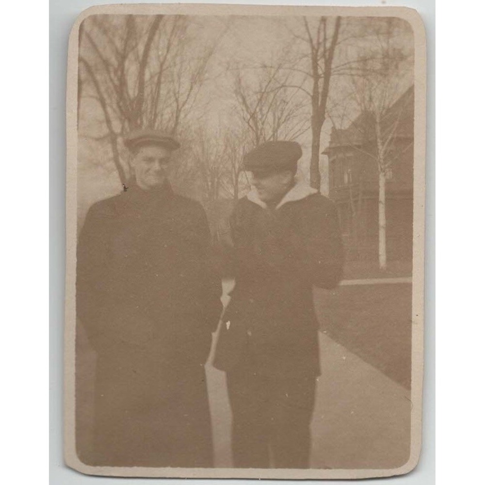 Vintage 1910s-1920s Sepia Photo Two Men Winter Coats Newsboy Caps - Picture 1 of 2
